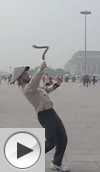David J Richardson throws and catches a boomerang in Tiananmen Square